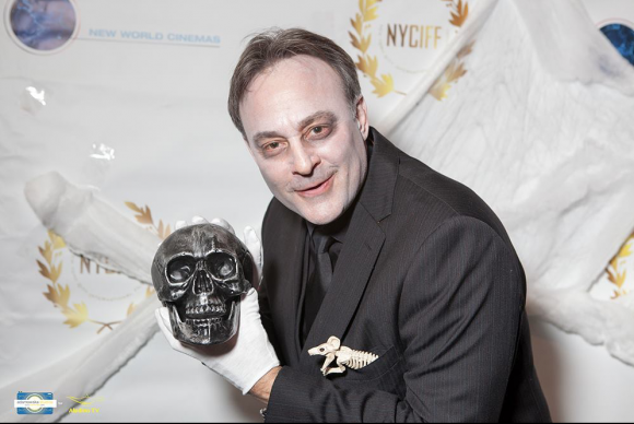 Alan Fine, in costume as a ghoulish writer/director, receives the Best Short Screenplay award